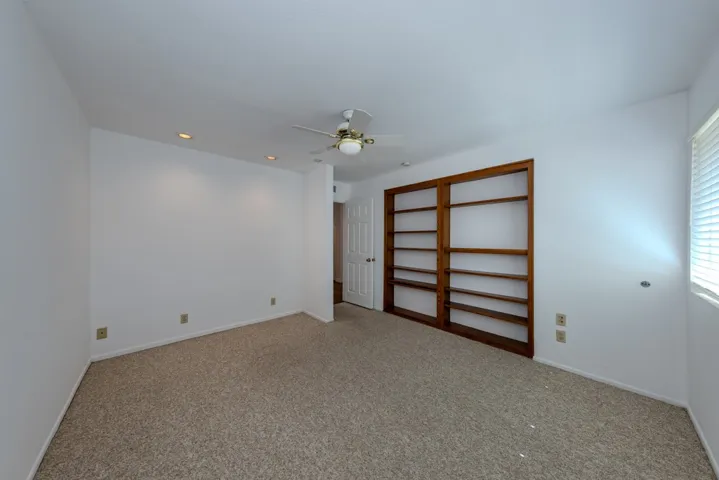 (bdrm 3) from its far corner was used as office by prior owner (note beautiful built-in bookshelves); former closet area can be seen left of doorway