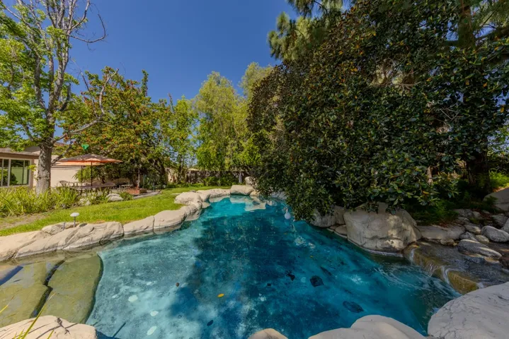stone-surrounded pool (realistic looking cement artificial stones, plus a few real boulders)