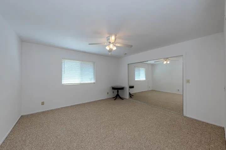 (bdrm 4) just outside primary suite, as seen from doorway; largest bdrm except for primary suite