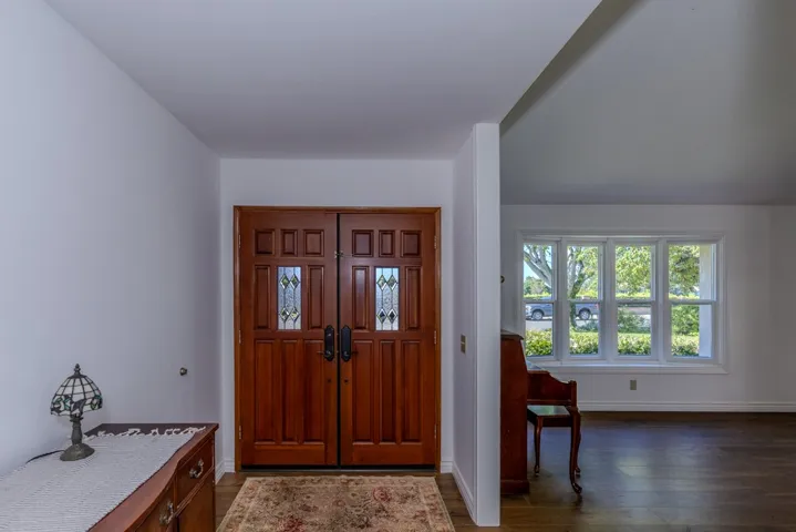 Entry from just inside (house faces south); front doors feature Baldwin lockset
