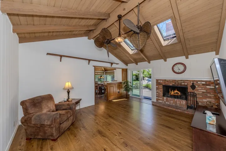 Den as viewed near entry (note openable skylights and giant ceiling fan)