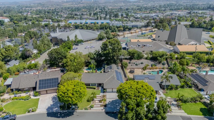 Neighborhood drone shot, home is the middle one (home backs to upper parking lot of Friends Church which is rarely used and sits at a lower elevation)