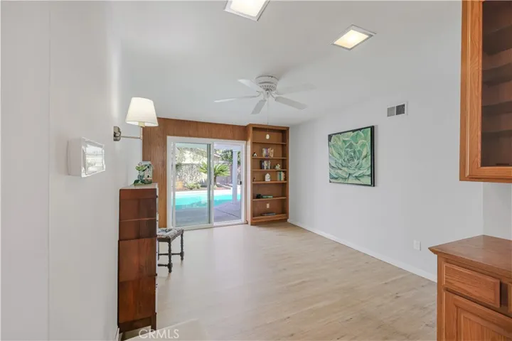 Family Room/Den-can be converted back to a fourth bedroom. Pool Views and Sliders to backyard!