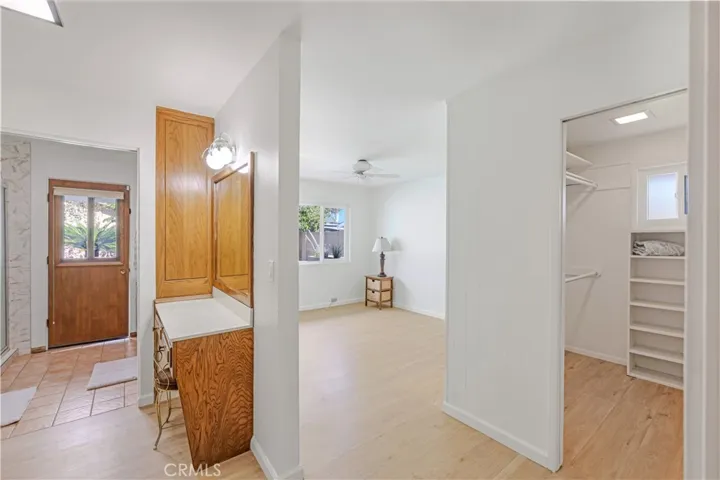 Primary Bedroom #1 Suite - Pool Views! Built-in Walk-in Closet. Dressing area with Vanity. Shower, sink and toilet room separated by pocket door. Door to Pool.