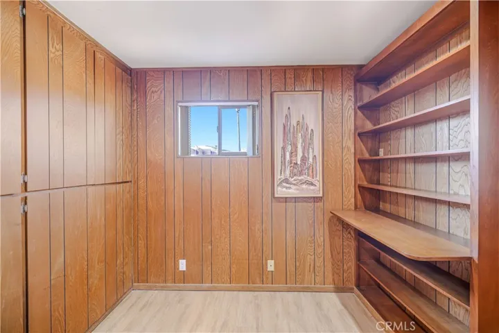 Office with built-in storage cabinets and shelves!