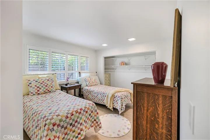 Bedroom #2 - faces the sideyard. Large closet. Wood shutters.