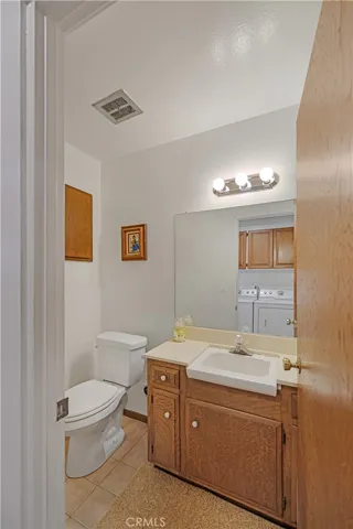Guest Bath is off the kitchen and laundry room