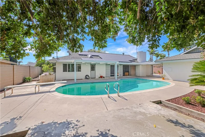 This large lot has a pool with exits to pool from Primary Bedroom, Family Room and Living Room!
