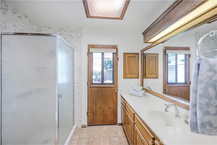 Primary Bath with direct access to pool- Imagine coming in from a cooling swim in the pool right to the shower!