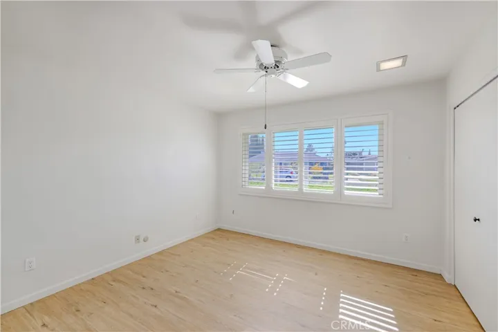 Bedroom 3 faces the front of the house. Large Closet. Wood Shutters and fan.