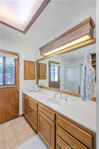Primary Bath - sink and wood cabinets