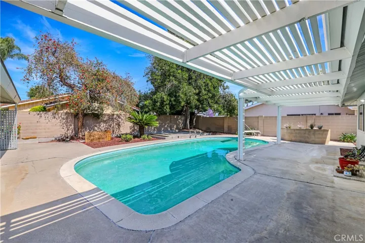 Pool with a covered patio! Just add your hot tub here! Enjoy your pool all year round!
