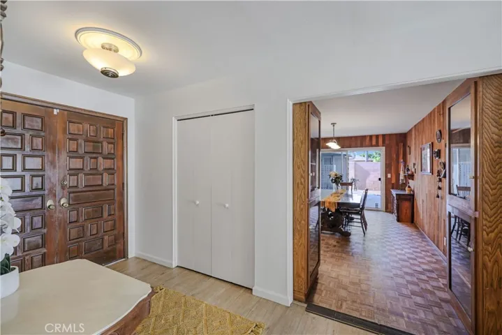 Front Entry with Coat Closet. Leads to Kitchen and Dining Room