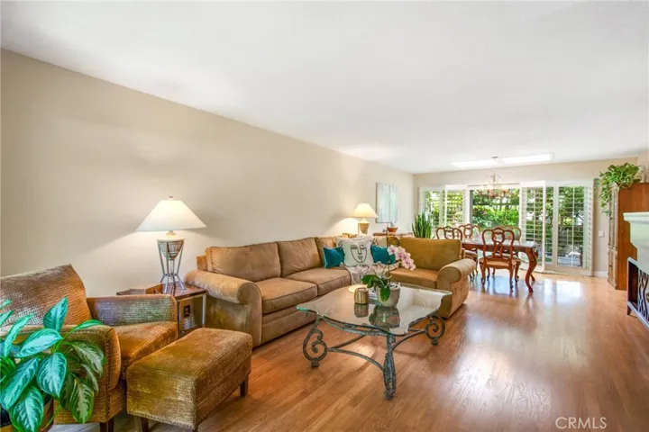 Living and dining room space including wood flooring throughout.