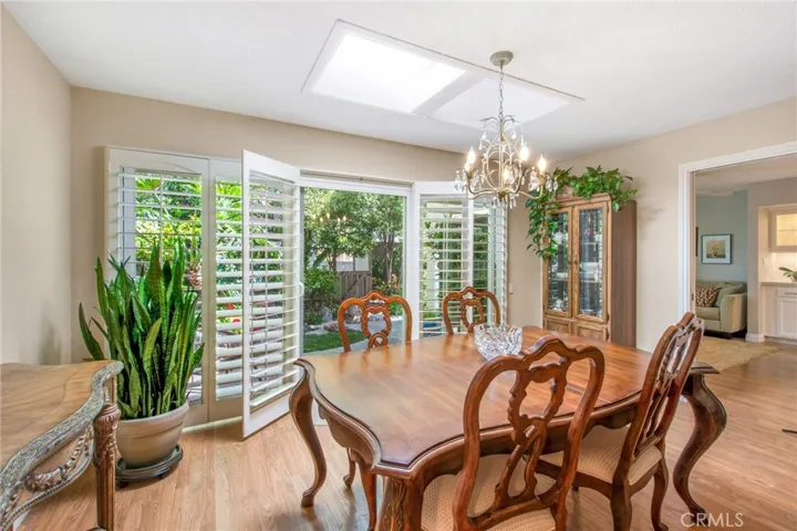 Dining room space including skylights and doorway to family room.