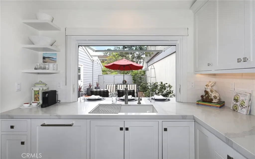 KITCHEN WINDOW OPENS TO COURTYARD KITCHEN WINDOW OPENS TO COURTYARD