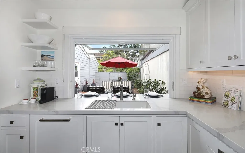 KITCHEN WINDOW OPENS TO COURTYARD