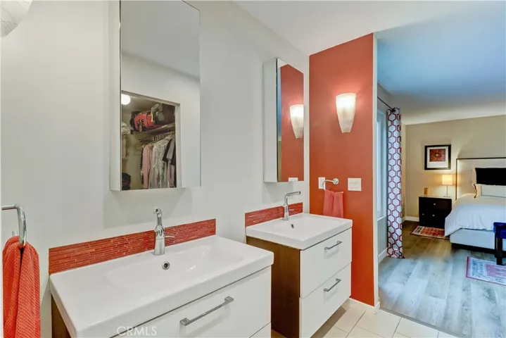 Primary en suite bathroom has dual vanities