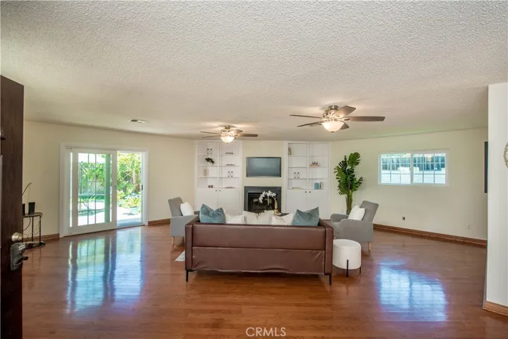 Large great room with new sliding door leading to patio.