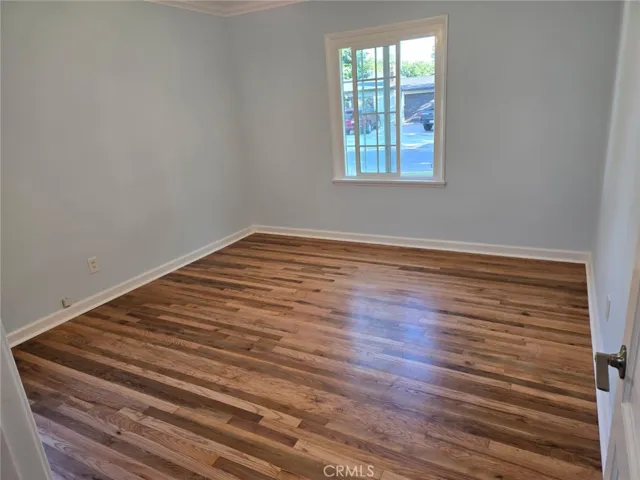 Newly refreshed/refinished 2nd bedroom. Improved closet space.
