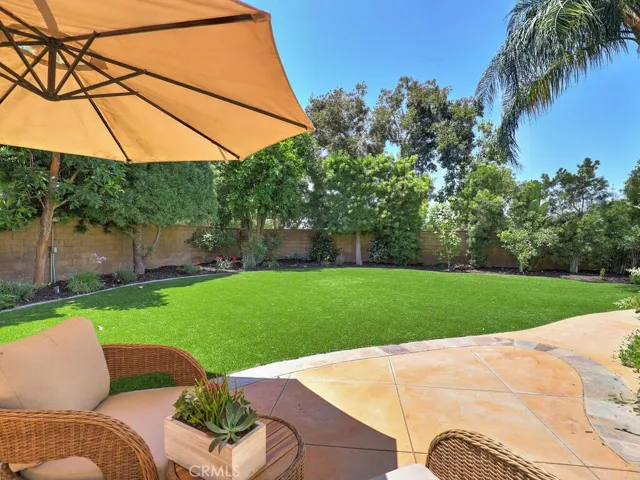 This beautiful gated lawn area flows from the wine-room and is surrounded by various fruit trees and is more expansive than it looks in this picture.