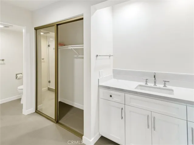 Primary Bath - quartz countertop. Mirror now Installed.