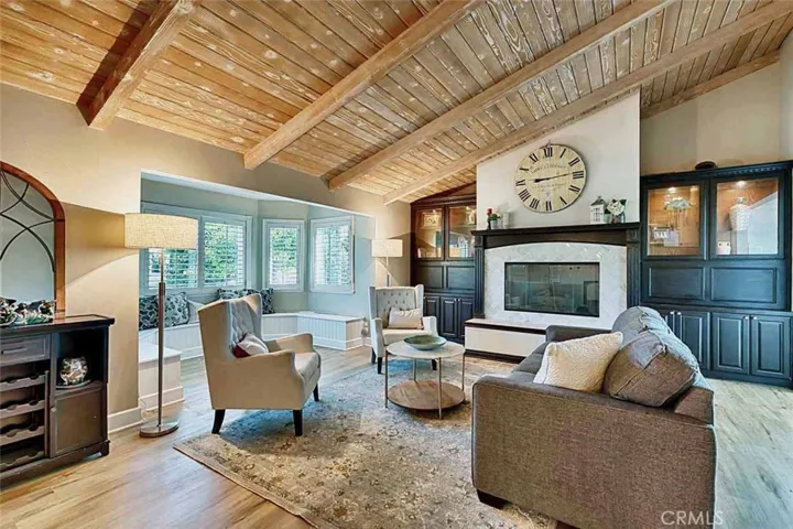 Living room with hand finished wood ceiling