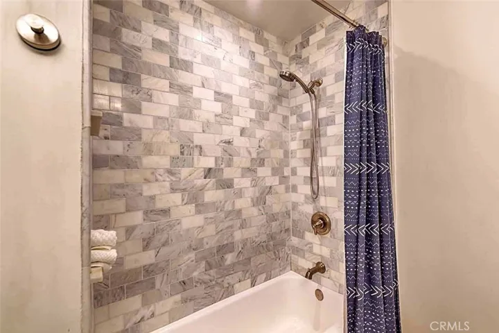 Shower updated with marble tile