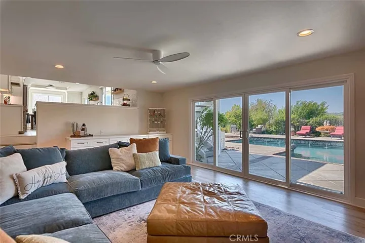 Family room with view of pool and hills