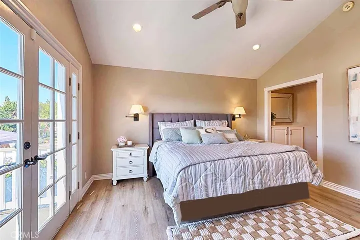 Primary bedroom with French doors to balcony