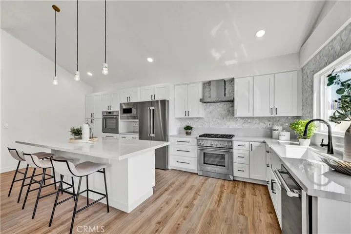 brand-new chef’s dream kitchen dazzles with quartz countertops, a center island