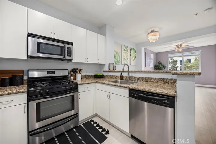 Perfect for entertaining, the kitchen opens to the living room.