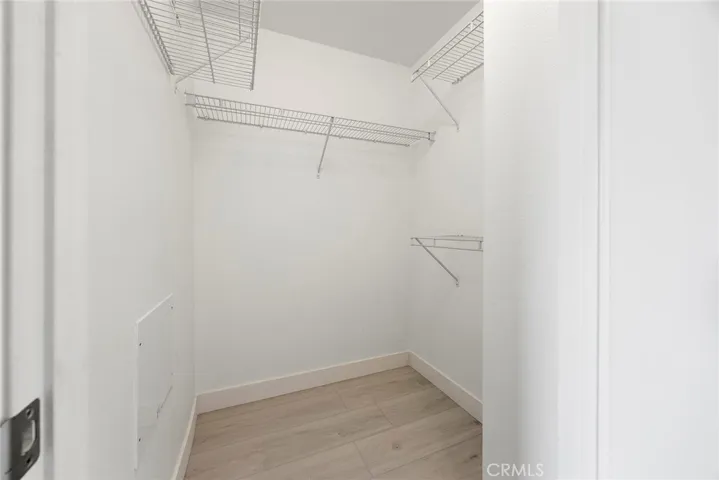 Walk in closet in between the laundry closet and primary bath.