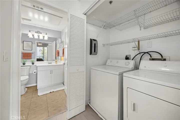 There is full sized side by side washer and dryer.