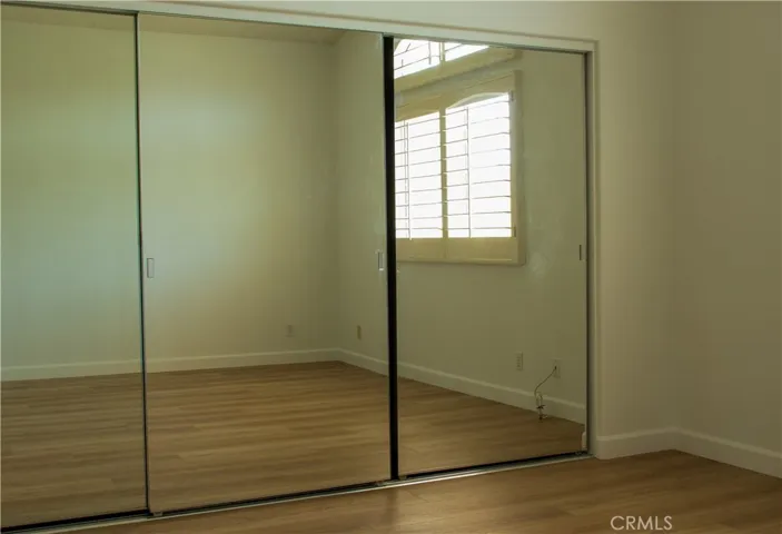 Primary bedroom with wall to wall closet.