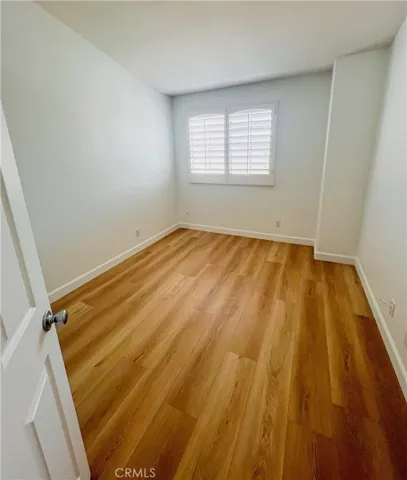 Bedroom one with mirrored closet doors.