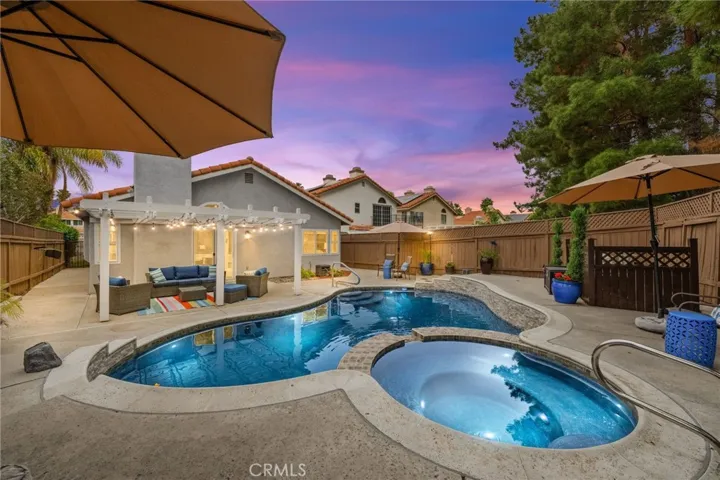 Twilight shot of the pool with​​‌​​​​‌​​‌‌​​‌​​​‌‌​​​‌​​‌‌​​‌‌​​‌‌​​​​ lighting.