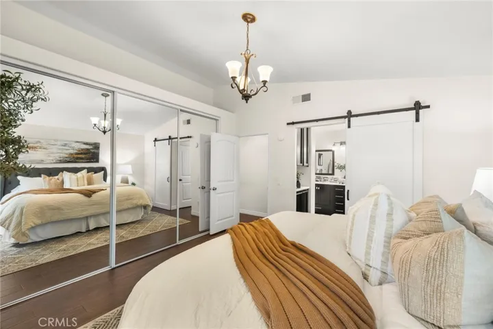 Master bedroom has a very large closet with sliding glass doors.