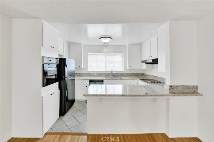 Kitchen has fresh paint and granite counters