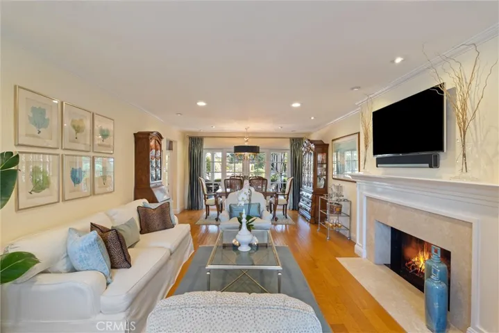 The combined living room/dining room leading to the outdoor oasis.