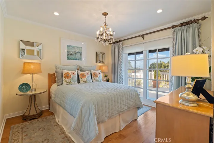 Guest bedroom leading to the outdoor deck.