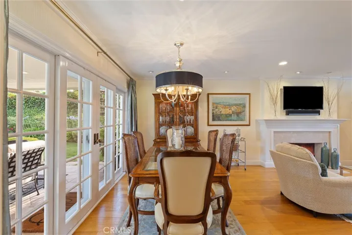 The formal dining room adjacent to the outdoor backyard experience.