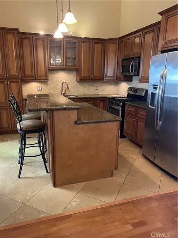 Kitchen complete with upgraded cabinetry and stainless steel appliances.