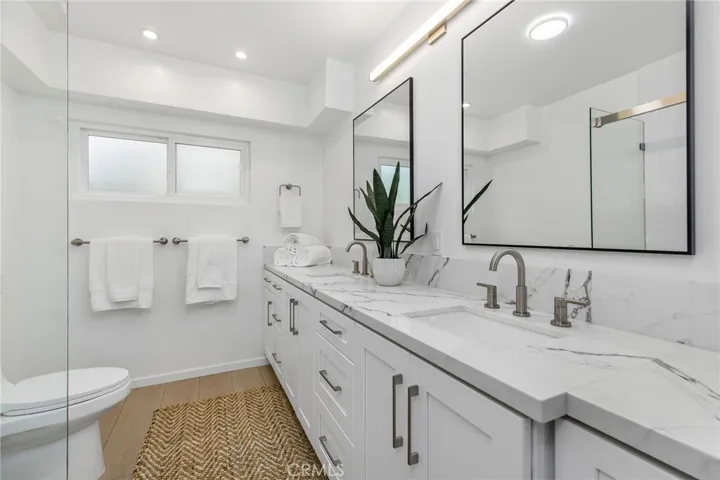Downstairs bathroom with dual sinks
