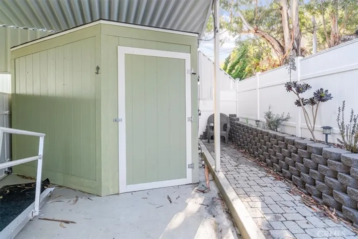 She shed or man cave has two separate access doors.