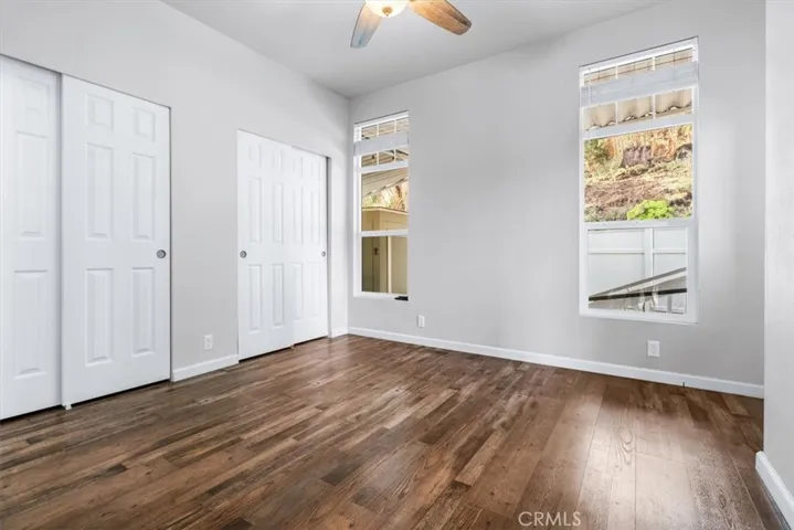 Primary bedroom is light and bright with a door to your private yard