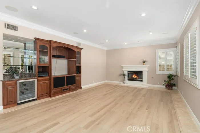 Family room with fire place and wine cooler