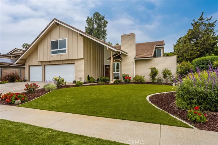 This traditional home features beautiful landscaping.