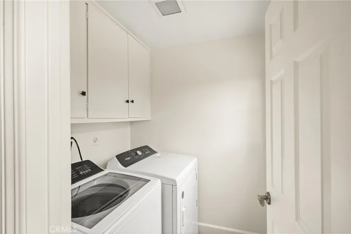Inside laundry features brand new washer and dryer.