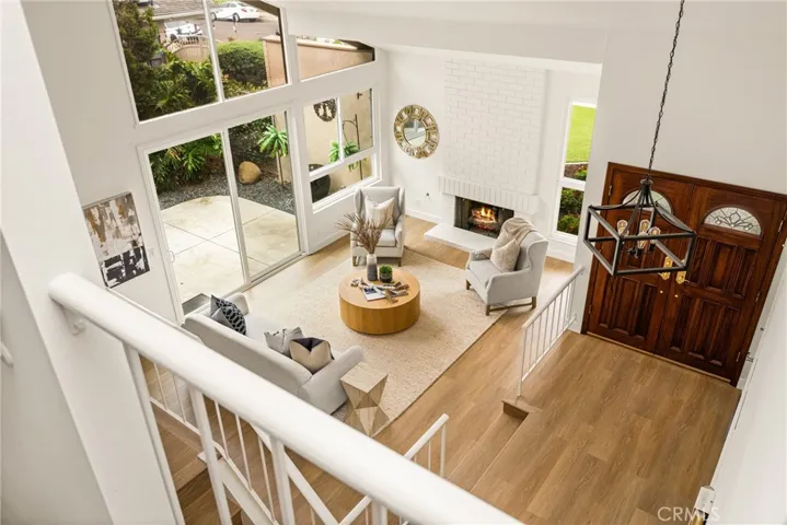 Cathedral ceilings and two story windows floods this newly remodeled Yorba Linda with